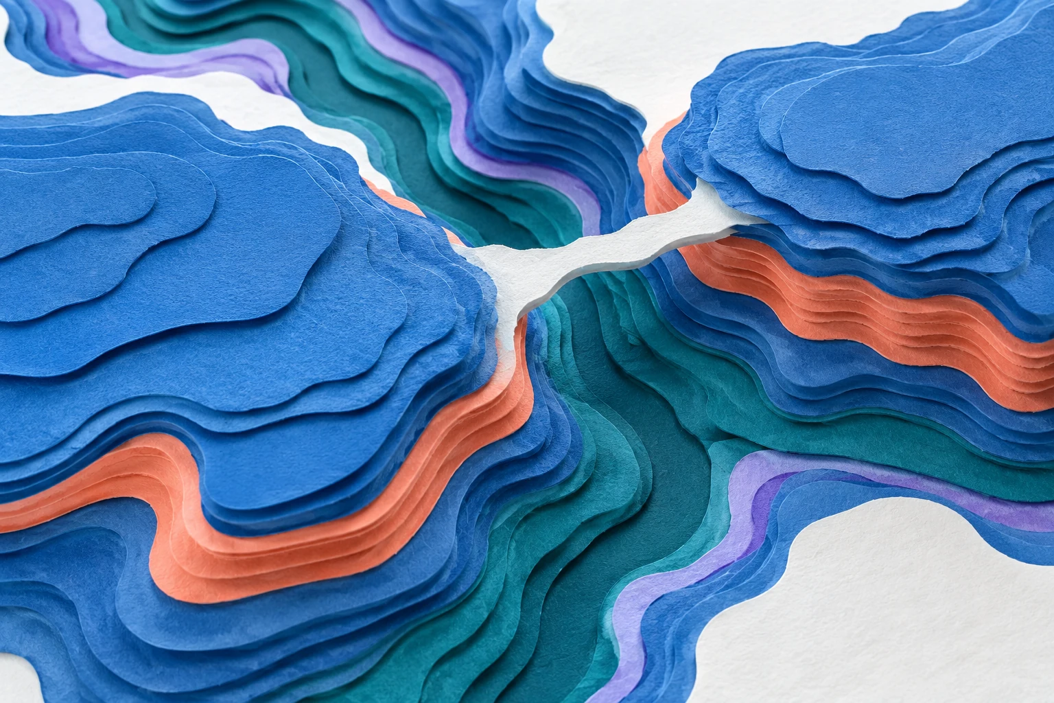Layered blue paper plateaus and coral strata meet a teal canyon channel beneath a pale connecting span.